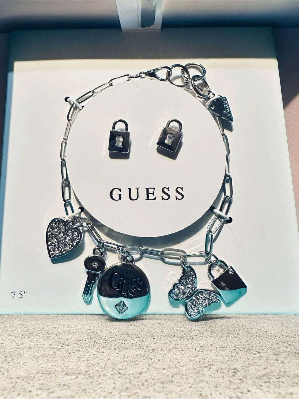 GUESS Silver-Tone Charm Bracelet with Heart, Key & Butterfly Charms solid color